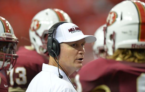 Mill Creek head coach Shannon Jarvis instructs players. (Hyosub Shin/AJC)