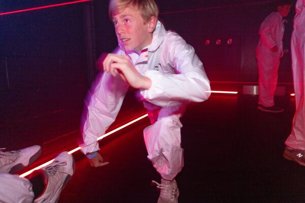 A team plays in the laser room at Beat the Bomb in Atlanta on Saturday, October 15, 2022. The Brooklyn-based immersive escape room experience recently opened its Atlanta location. (Photo by Jenn Finch)