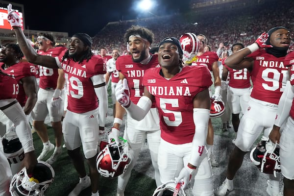 Indiana players celebrate after defeating Michigan in an NCAA college football game in Bloomington, Ind., Saturday, Nov. 9, 2024. (AP Photo/AJ Mast)