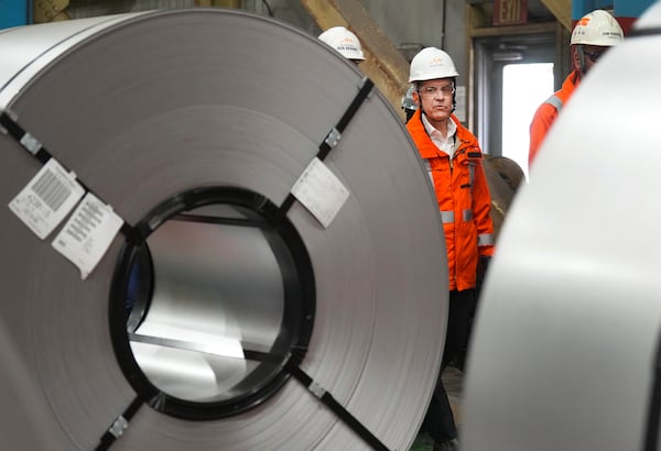 Canadian Prime Minister designate Mark Carney tours the ArcelorMittal Dofasco steel plant in Hamilton, Ontario, on Wednesday, March 12, 2025. (Nathan Denette/The Canadian Press via AP)