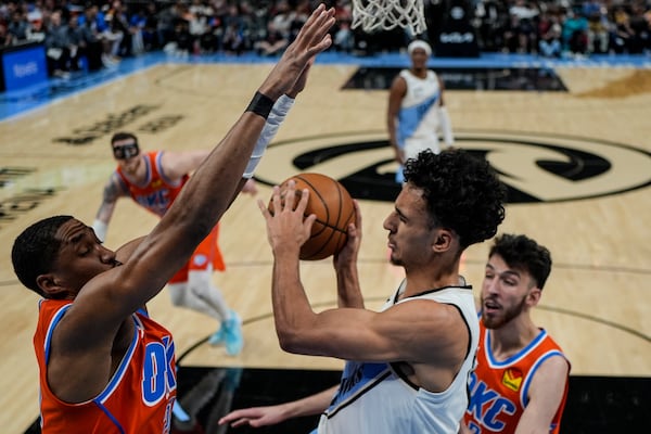 Atlanta Hawks forward Zaccharie Risacher (10) shoots against the Oklahoma City Thunder during the first half of an NBA basketball game, Friday, Feb. 28, 2025, in Atlanta. (AP Photo/Mike Stewart)