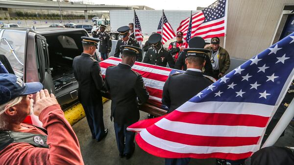 The Georgia National Guard Honor Guard place the body of United States Army Pfc. Lamar Eugene Newman who served during the Korean War and went MIA and declared deceased in November of 1950 in the hearse after returning home after 67-years.