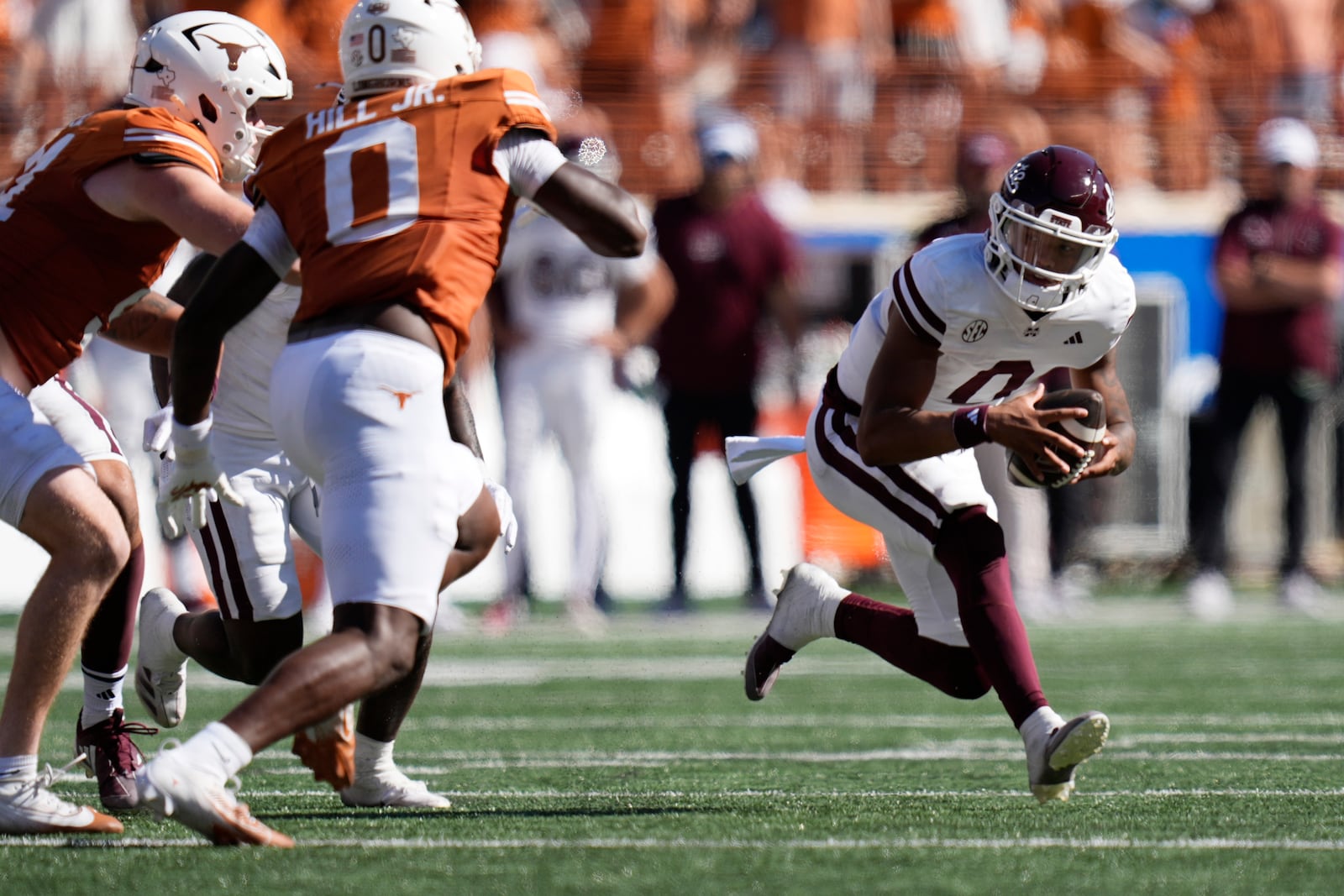 Mississippi State quarterback Michael Van Buren Jr. (0) tries to run again Texas linebacker Anthony Hill Jr. (0) during the first half of an NCAA college football game in Austin, Texas, Saturday, Sept. 28, 2024. (AP Photo/Eric Gay)