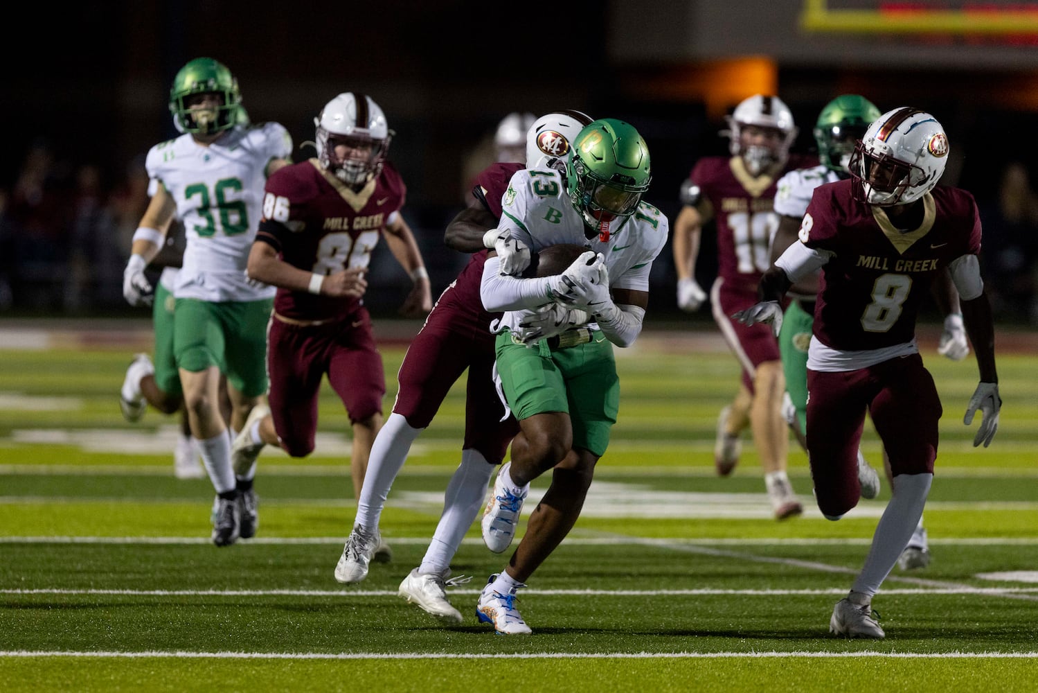 Buford’s Tyriq Green (13) gains yards against Mill Creek. (Photo/Jenn Finch, AJC)