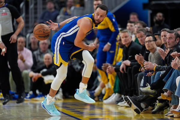 Golden State Warriors guard Stephen Curry keeps the ball inbounds during the first half of an NBA basketball game against the Denver Nuggets, Monday, March 17, 2025, in San Francisco. (AP Photo/Godofredo A. Vásquez)