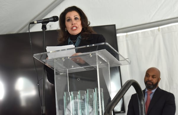 December 15, 2016 Atlanta - Eloisa Klementich, CEO of Invest Atlanta, speaks as councilman Kwanza Hall (background) looks during City of Lights Grand Opening Celebration at City Lights Senior Housing, a new affordable senior housing facility, in Atlanta on Thursday, December 15, 2016. Kwanza Hall takes the wraps off a new affordable housing development for seniors on Thursday in his downtown district. HYOSUB SHIN / HSHIN@AJC.COM