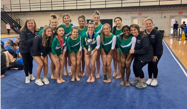 The Ola High School gymnastics team celebrates its Henry County championship.