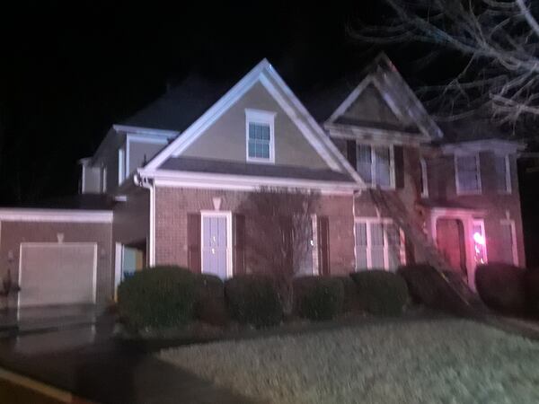 When fire crews entered the home, they encountered thick smoke  and heavy flames in the attic space near the back left corner of the residence, according to Gwinnett County fire officials. 