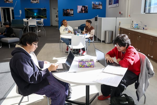 Brothers Brian Lopez, 16, and Romeo Mazariego, 17, both of Norcross, do their schoolwork at the Gwinnett County Acceleration Academies, Wednesday, Nov. 1, 2023, in Duluth. The Acceleration Academies gives Gwinnett County students who have dropped out of high school a chance to finish their diplomas in a more independent environment. (Jason Getz / Jason.Getz@ajc.com)