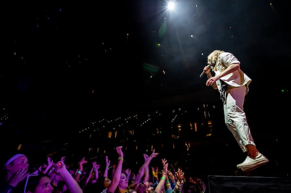 Singer Aaron Bruno of Awolnation takes flight at State Farm Arena. The band opened for Twenty One Pilots.  Photo: Ryan Fleisher/Special to the AJC