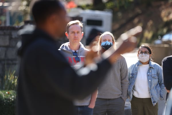 State Rep. David Dreyer listens as Andre Dickens speaks during a meet-and-greet in Grant Park. Miguel Martinez for The Atlanta Journal-Constitution 