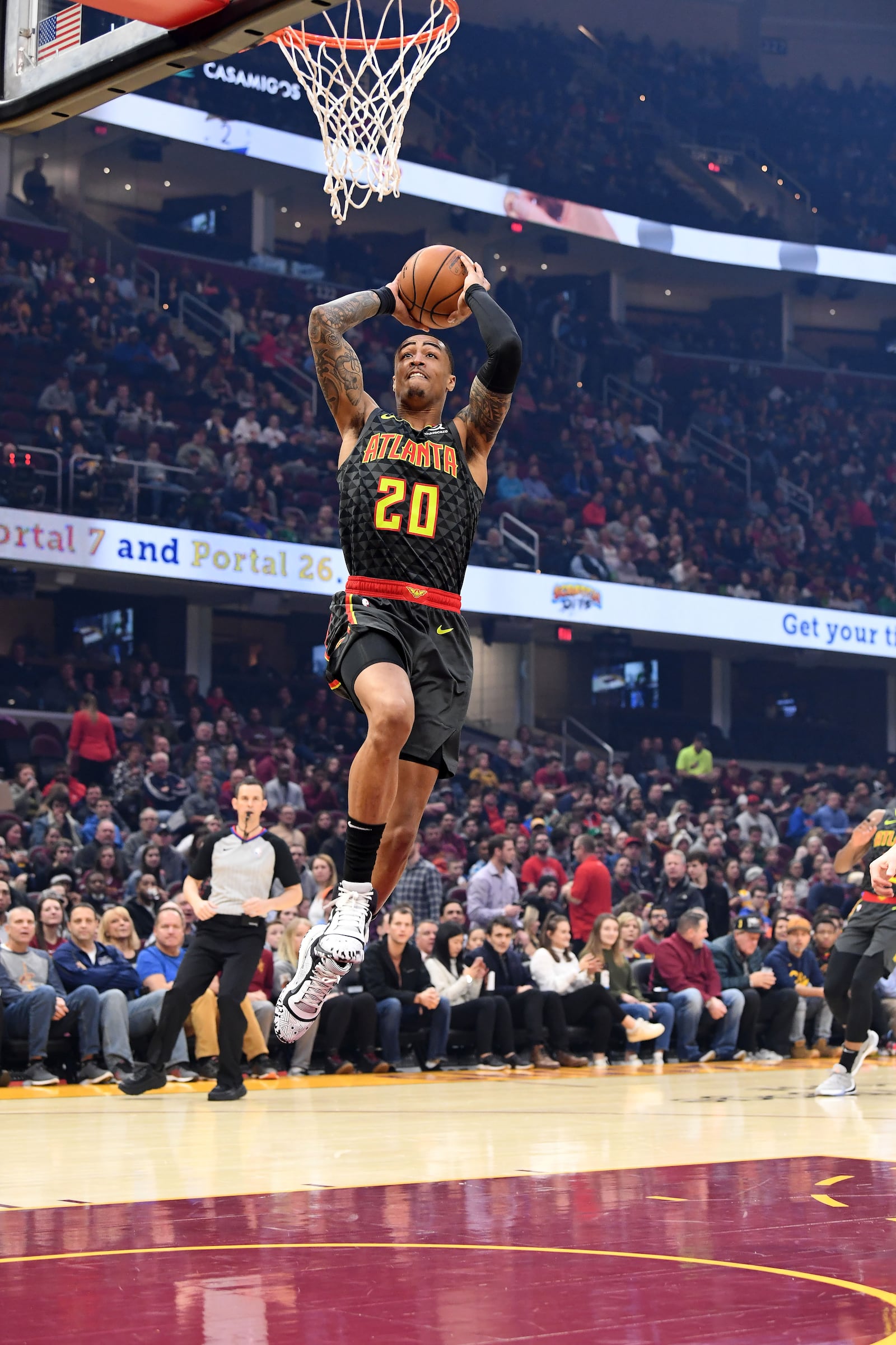 John Collins dunks during the first half of Monday's game against the Cavaliers in Cleveland, Ohio. (Photo by Jason Miller/Getty Images)