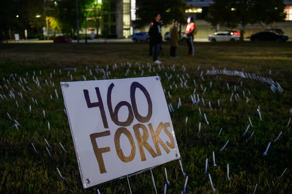 Protesters plant 460 forks in the ground outside of the closed Atlanta Medical Center on this, the anniversary of it's closing. November 1, 2023 (Jamie Spaar for the Atlanta Journal Constitution)