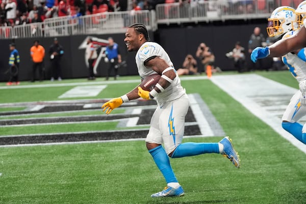 Los Angeles Chargers safety Derwin James Jr. (3) celebrates after an interception during the second half of an NFL football game against the Atlanta Falcons on Sunday, Dec. 1, 2024 in Atlanta. (AP Photo/John Bazemore)