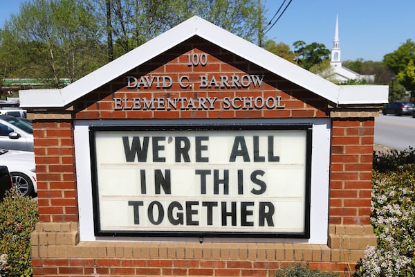 Local schools and churches are on shutdown but the sign at David C. Barrow Elementary School in Athens posts what is fast becoming a national motto. Curtis Compton/ccompton@ajc.com