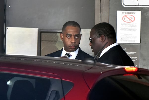 Atlanta’s former chief purchasing officer, Adam Smith (left), leaves the federal courthouse in September afte pleading guilty to accepting more than $30,000 in bribes from an unnamed city vendor. That plea has roiled the race to succeed Atlanta Mayor Kasim Reed. HYOSUB SHIN / HSHIN@AJC.COM