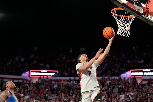 Georgia guard Tyrin Lawrence (7) shoots the ball during an NCAA college basketball game against Florida, Tuesday, Feb. 25, 2025, in Athens, Ga. (AP Photo/Brynn Anderson)