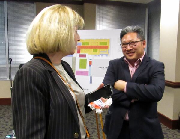 David Lee promotes his night market concept in January, 2017 to the Gwinnett Chamber of Commerce, including Margie Asef (left), community relations manager for the chamber.