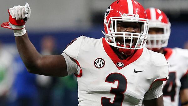 Georgia linebacker Roquan Smith (3) yells out commands before Auburn runs a play during the SEC title game in Atlanta.