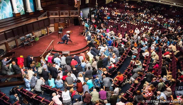 The Rev. Charles F. Stanley, leading his congregation in prayer in this photo, grew First Baptist into one of Atlanta's best known megachurches.
