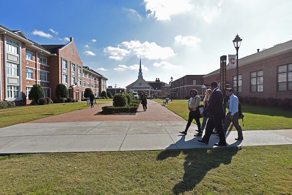 Dr. Henry Tisdale, president of Claflin University, talks with students as they walk to a cafeteria in Claflin University campus in Orangeburg, South Carolina on Thursday, November 30, 2017. Claflin University has a proud and enduring legacy of producing visionary leaders committed to making a difference in a constantly changing global society. (HYOSUB SHIN / HSHIN@AJC.COM)