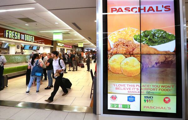 Many of the restaurants that line Concourse B at Hartsfield-Jackson International Airport won locations through a contested bidding process in 2012. CURTIS COMPTON/CCOMPTON@AJC.COM