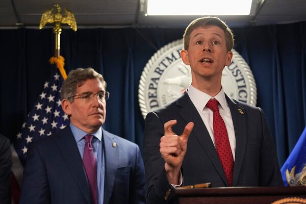 Christopher R. Kavanaugh, the United States Attorney for the Western District of Virginia, gestures while announcing that the McKinsey & Company agreed to pay $650 million for helping Purdue Pharma boost opioid sales during a news conference at the Moakley Federal Courthouse, Friday, Dec. 13, 2024, in Boston. (AP Photo/Charles Krupa)