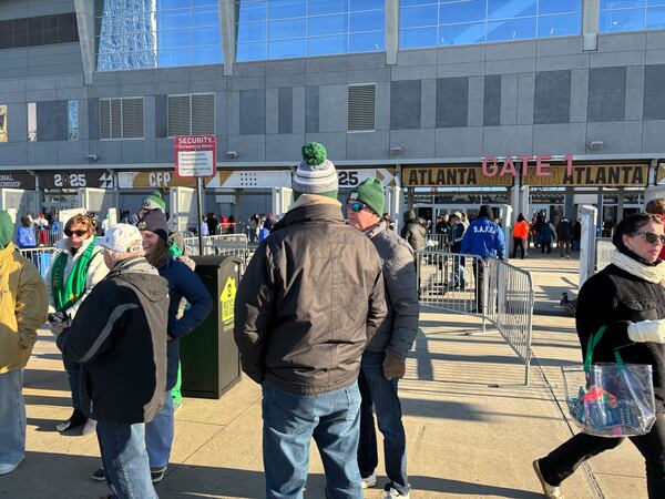 Notre Dame fans talk outside Gate 1 prior to Monday's game between the Fighting Irish and the Ohio State Buckeyes in Atlanta.