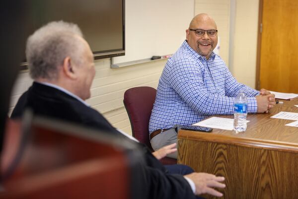 Steven Allwood, center, listens as his father Vernon Allwood speaks during the Eddie Gaffney lecture series about mental health at Dansby Hall on the Morehouse College campus, Tuesday, October 17, 2023, in Atlanta. (Jason Getz / Jason.Getz@ajc.com)