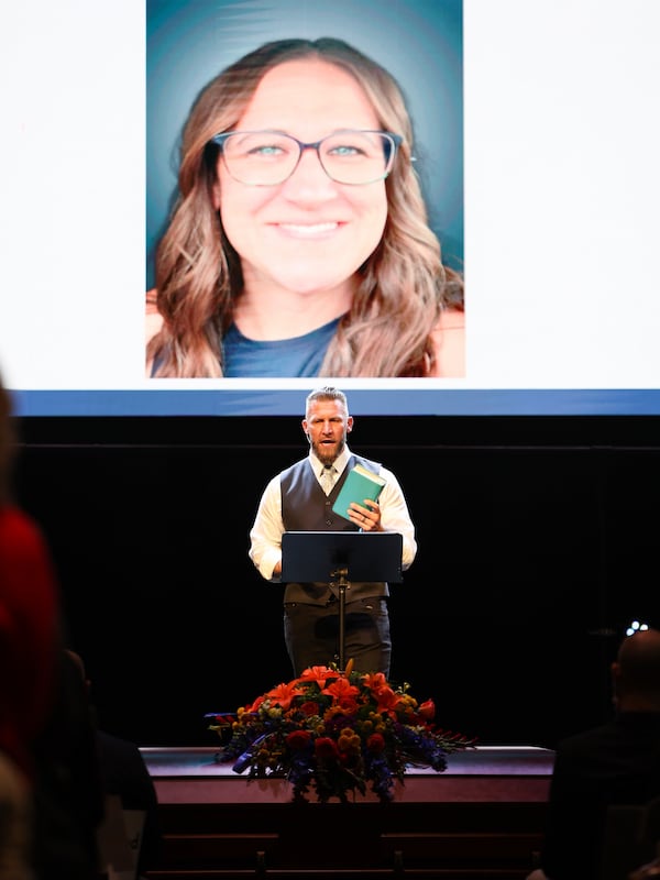 DOXA Church Lead Pastor Rob Warren holds Erin Michelle West's personal Bible while talking about her life on Monday, Dec. 23, 2024 at DOXA Church in Fitchburg, Wis. (Owen Ziliak/Wisconsin State Journal via AP)