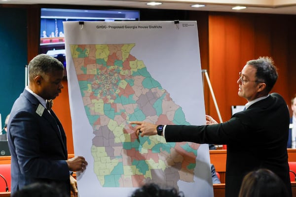 Lawyer Bryan Sells, right, and House Minority Leader James Beverly present the Democrats’ redistricting proposal at the Georgia Capitol. Miguel Martinez /miguel.martinezjimenez@ajc.com