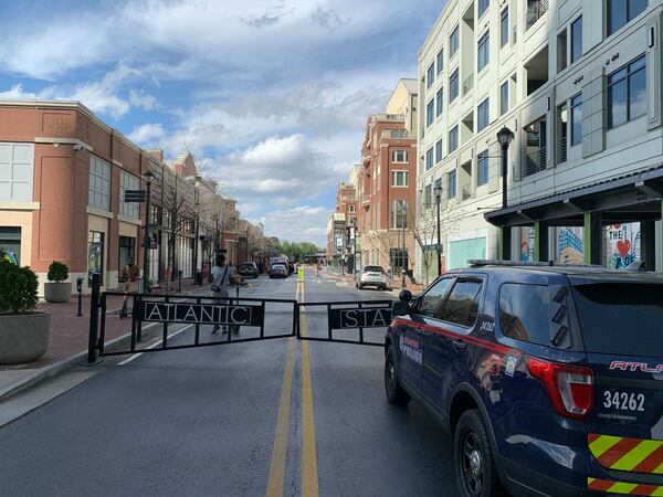 A man was detained Wednesday after taking six guns and body armor into an Atlantic Station grocery store, police said.