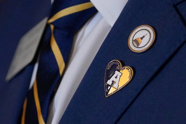 Georgia state Rep. Holt Persinger, R-Winder, wears a pin supporting Apalachee High School while the House debates HB 268, a school safety bill , Tuesday, March 4, 2025, in the Capitol in Atlanta. (Matthew Pearson/WABE via AP)