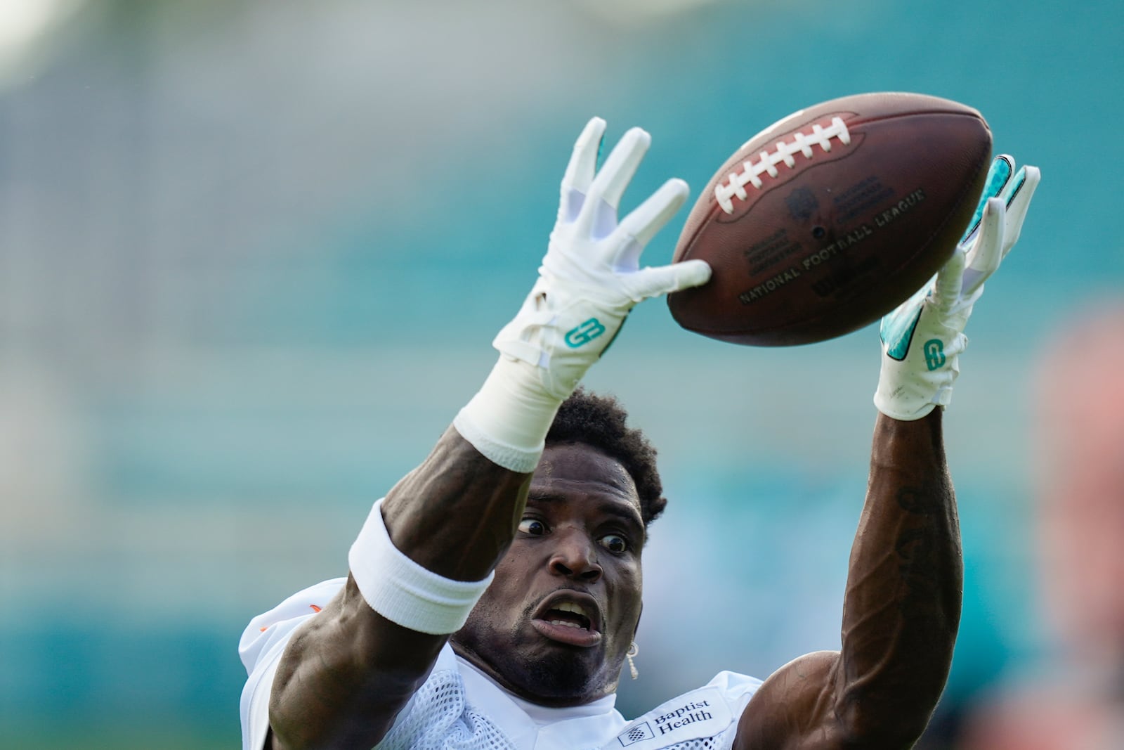 Miami Dolphins wide receiver Tyreek Hill (10) catches a pass during a team practice session, Wednesday, Sept. 11, 2024, in Miami Gardens, Fla. (AP Photo/Rebecca Blackwell)