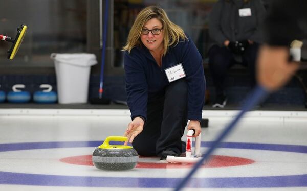 Michelle Landis launches a granite curling rock down the ice during a Learn2Curl class at the Chicago Curling Club on January 10, 2018, in Northbrook, Ill. The Club is celebrating its 70th year. (Stacey Wescott/Chicago Tribune/TNS)