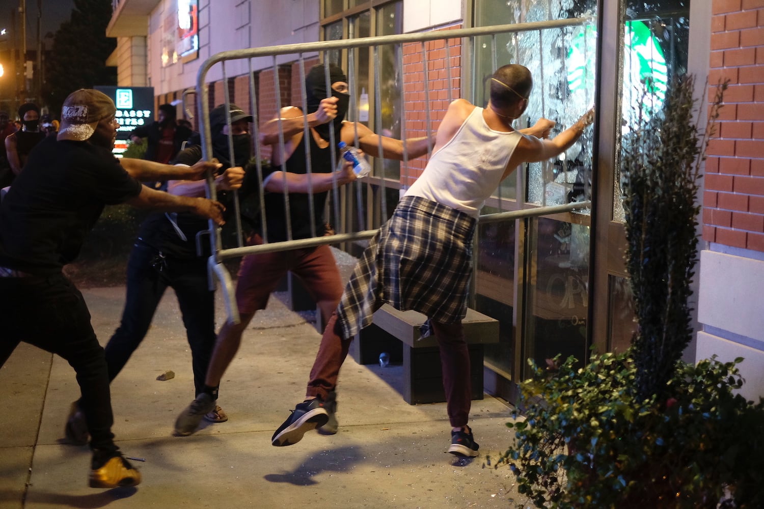 PHOTOS: Atlanta rally against police violence draws hundreds, turns violent