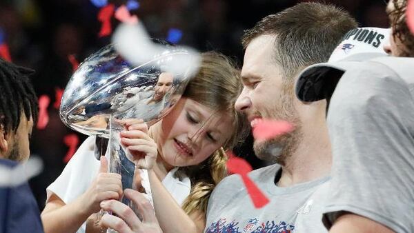 New England Patriots quarterback Tom Brady shares a moment with daughter Vivian Lake Brady after winning his sixth Super Bowl, 13-3, against the Los Angeles Rams in Super Bowl LIII at Mercedes-Benz Stadium in Atlanta, Ga. on Sunday, Feb. 3, 2019.   Bob Andres / bandres@ajc.com