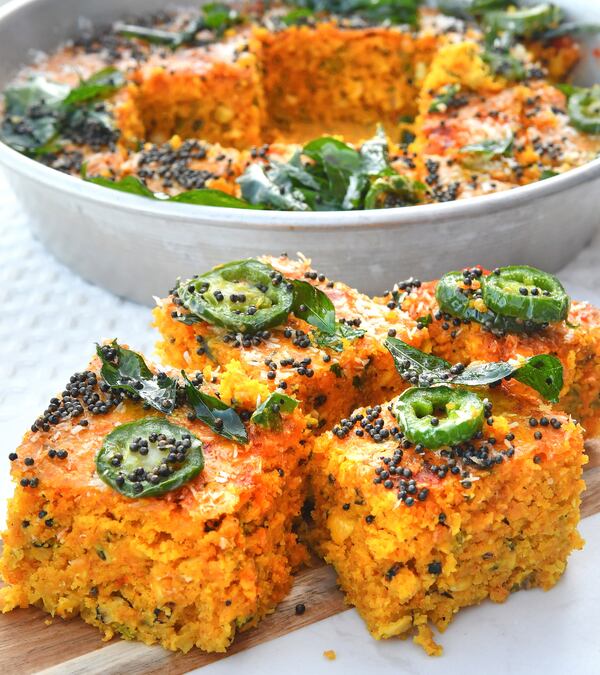 Khaman Cornbread. In Gujarat, where Farhan Momin's parents are from, a favorite street snack is khaman dhokla (squares of steamed chickpea-flour bread). Use cornmeal as the base, and you have something very similar to Southern cornbread. Momin finishes his jalapeno and whole-kernel cornbread the traditional Gujarati way — tempered with a heady drizzle of oil (or ghee) infused with dried chiles, black mustard seeds, coconut and curry leaves. (Styling by chef Farhan Momin / Chris Hunt for the AJC)