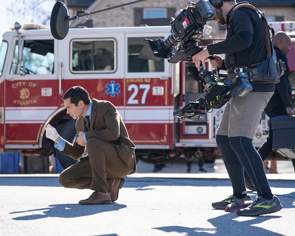 Actor Ramón Rodriguez stops to inspect evidence on the set of "Will Trent," an ABC procedural that is currently filming its third season in Georgia. The television show, which is set in Atlanta, has employed many Georgia crew workers since its start in 2022. (Disney/Daniel Delgado Jr.)