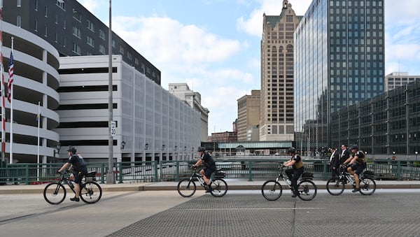 Police patrol downtown Milwaukee near the Republican National Convention site. (Hyosub Shin / AJC)