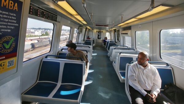 Sep. 23, 2013 - Ric Jilla, (right) rides MARTA from the Doraville station into Atlanta. BOB ANDRES / BANDRES@AJC.COM