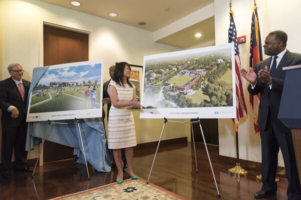 From left, Raymond King, president and CEO of Zoo Atlanta, Amy Phuong, commissioner of the city’s Department of Parks and Recreation, and then-Mayor Kasim Reed reveal renderings of the Grant Park Gateway Project during a press conference in Atlanta, Georgia, on Tuesday, April 25, 2017. The Grant Park Gateway Project aims alleviate traffic and address a lack of parking by constructing a new parking garage near Zoo Atlanta on Boulevard. DAVID BARNES / AJC