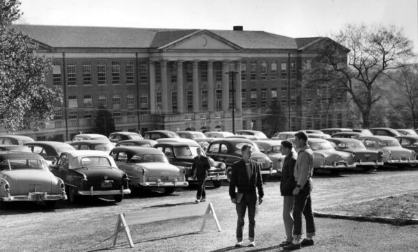 Human remains found at the site of the University of Georgia’s Baldwin Hall halted work on an expansion and renovation project of the 77-year-old building. The unpaved parking lot in front of Baldwin Hall is shown in this historic 1955 photo. 