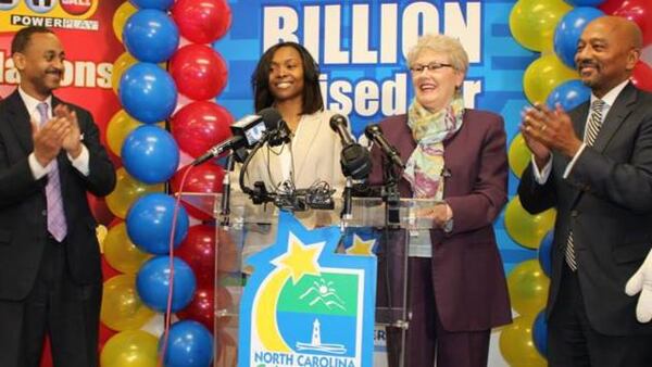 Marie Holmes (second from left) won $88 million (after taxes) in a Powerball drawing in 2015.