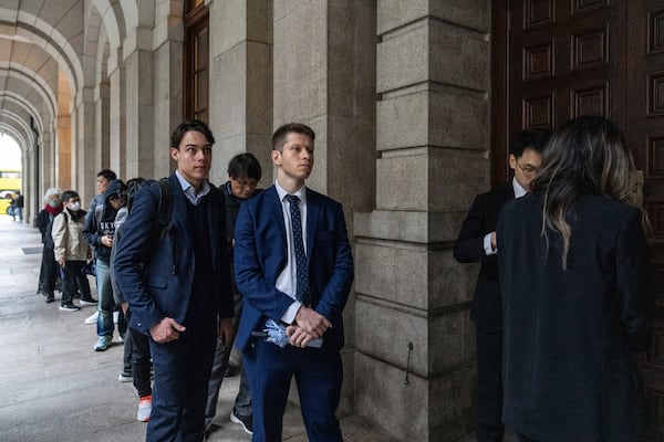 Representatives from the Italy and EU consulates wait outside the Court of Final Appeal in Hong Kong, Thursday, March 6, 2025. (AP Photo/Chan Long Hei)