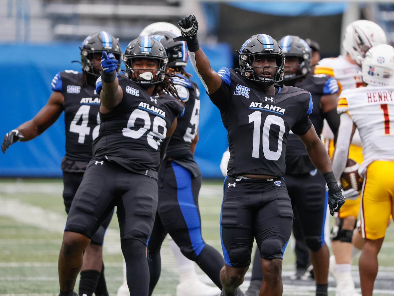 Georgia State Panthers defensive end Javon Denis and  linebacker Jacorey Crawford celebrate a first-quarter quarterback sack.   (Bob Andres for the Atlanta Journal Constitution)