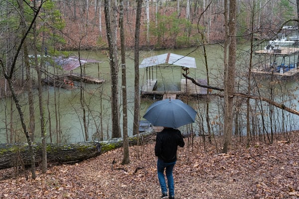 Baron Smith takes a walk down to his dock at his Lake Lanier home.