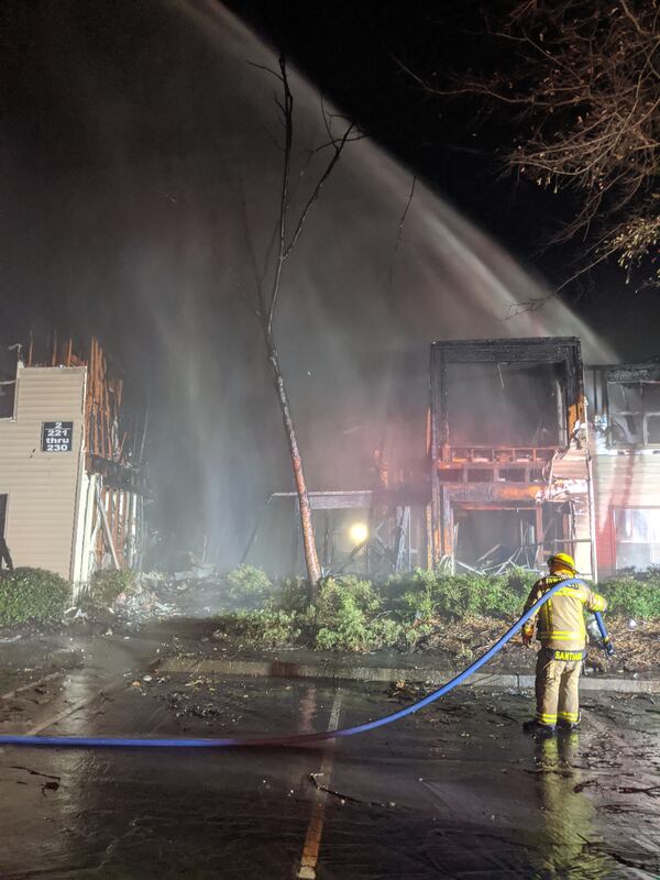 The 10-unit apartment building partially collapsed because of the flames.