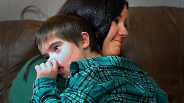 Carrie Defenbaugh holds her son Grayson during a Dec. 23, 2024, interview with the Ledger-Enquirer. (Photo Courtesy of Mike Haskey)