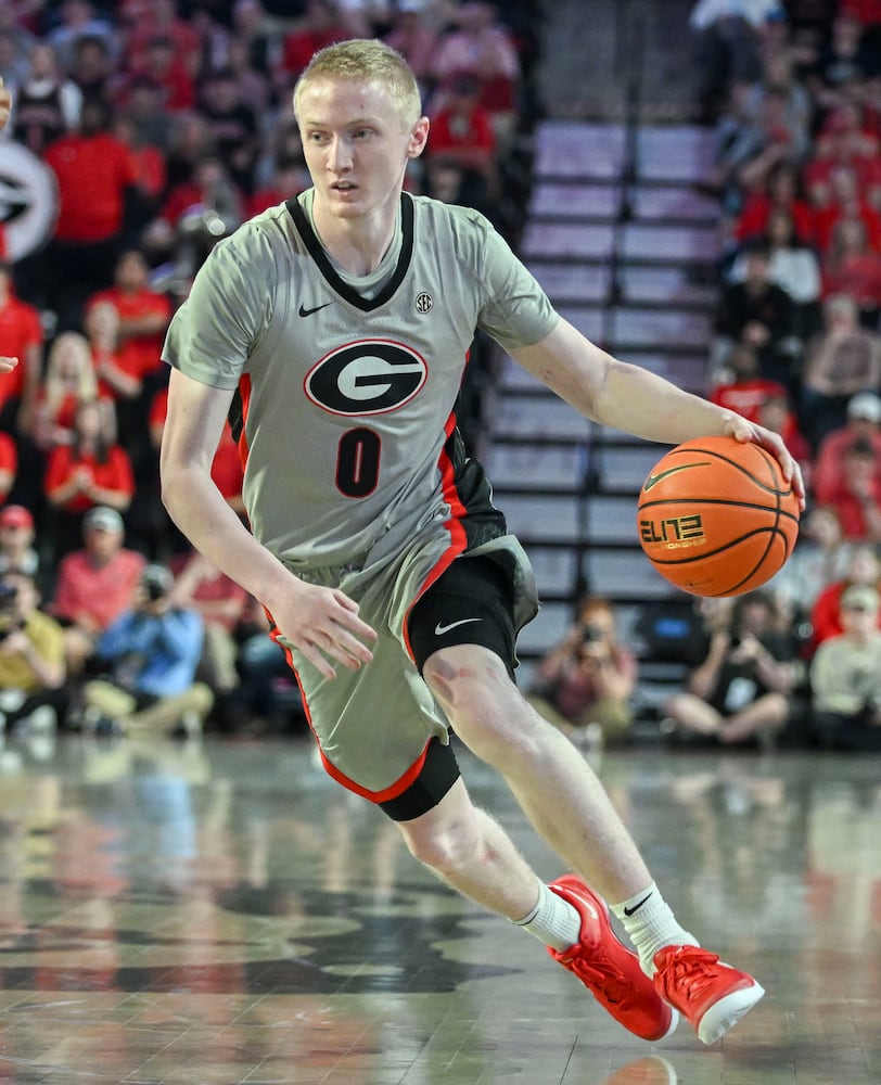 Georgia guard Blue Cain (0) drives to the basket against Vanderbilt’s defense during the second half of an NCAA Basketball game Saturday, March 8, 2025 at Stegeman Coliseum in Athens. Georgia beat Vanderbilt 79-68 (Daniel Varnado/For the Atlanta Journal-Constitution)